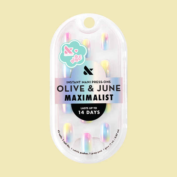 Rainbow Aura Chrome - Press-On | Short | Round iridescent rainbow gradient false nails in clear bubble packaging against beige background