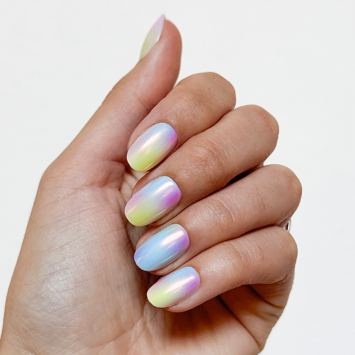 Rainbow Aura Chrome - Press-On | Short | Round soft gradient false nails shown on hand with natural lighting for at home mani