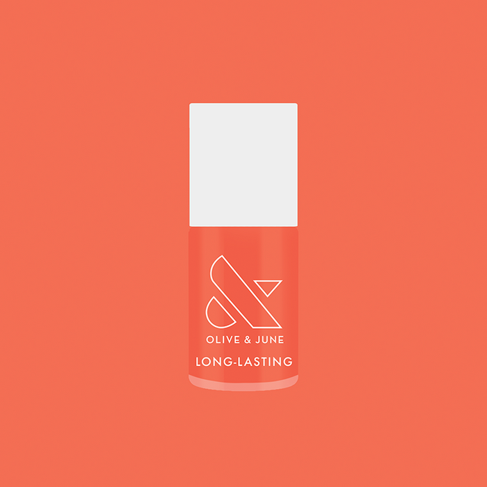 Olive and June Ride into the Sunset long-lasting gel polish bottle on matching coral background