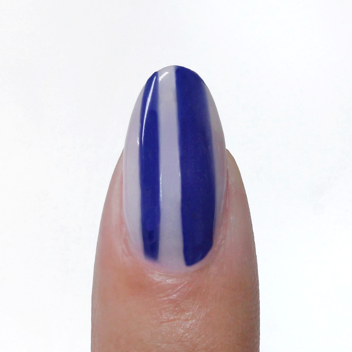 Royal Blue liner used for blue vertical stripes on a sheer nude nail
