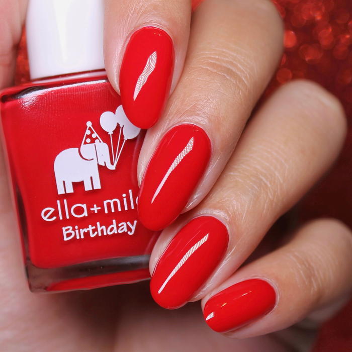 Royal Ruby bright red nail polish close-up with the bottle