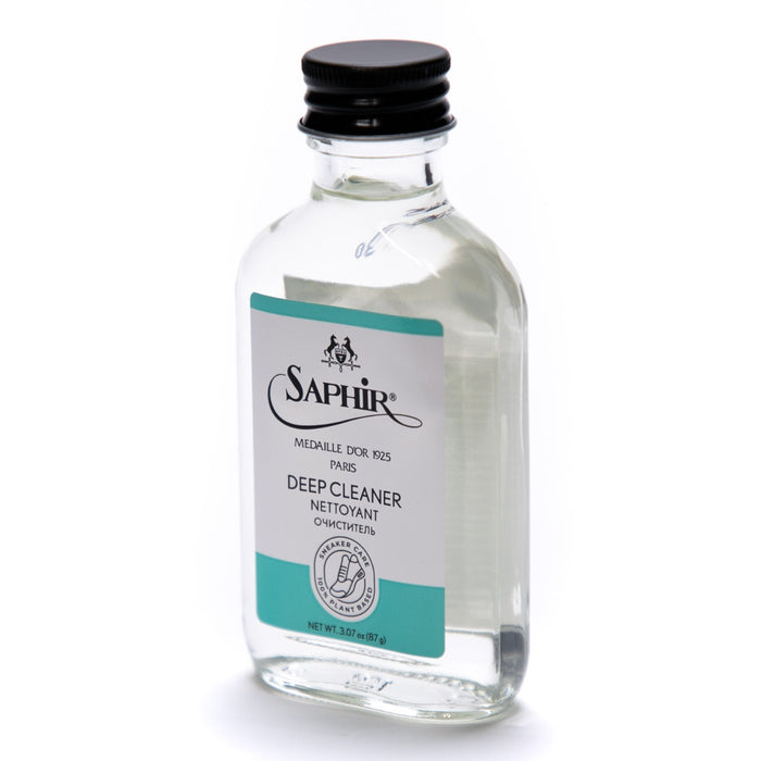 A KirbyAllison.com Saphir Sneaker Deep Cleaner - 100ml bottle on a white background, featuring a vegetable-based cleaner for deep cleaning.