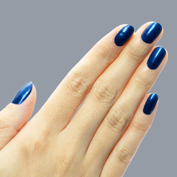 Hand with medium-length nails painted in Sapphire Season showing deep blue gel polish with shiny chrome finish manicure