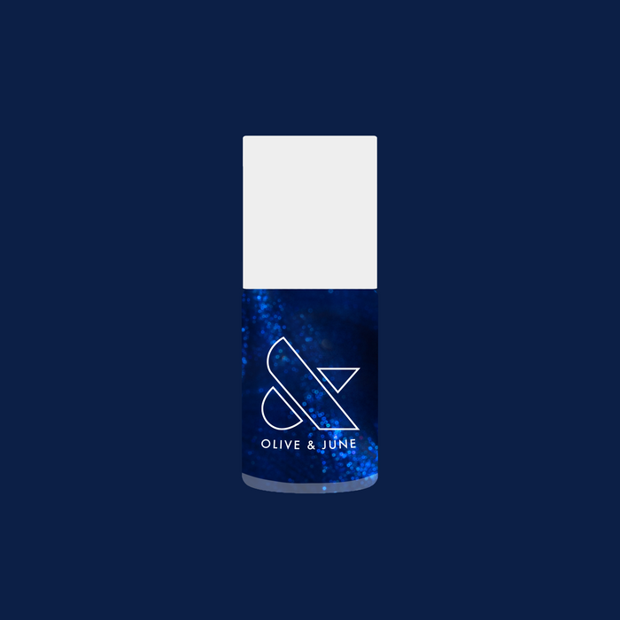 Olive and June Sapphire Season nail polish bottle featuring deep sapphire blue shade with shimmery gel polish finish