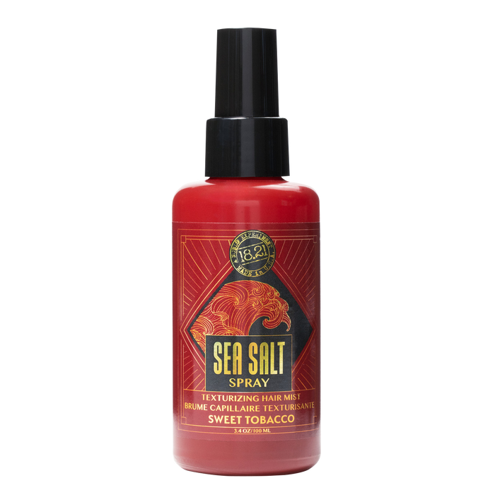 Red spray bottle labeled 'Sea Salt Spray' on a white background