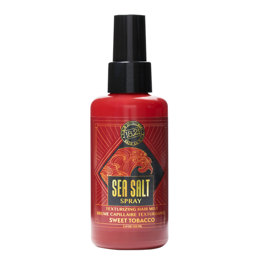 Red spray bottle labeled 'Sea Salt Spray' on a white background