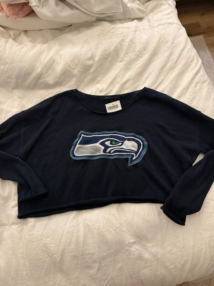 Navy blue shirt with a logo