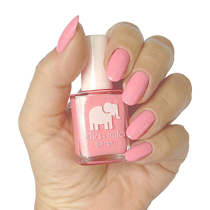 Set the Barre High rosy pink nail polish manicure on a light skin tone with the bottle