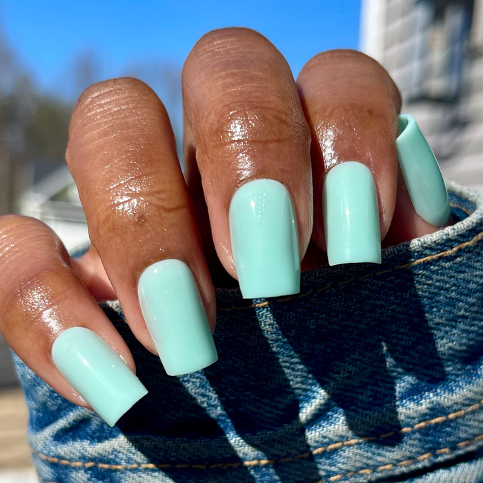 Slam Dunk - Press-On | Medium | Square true turquoise press-on nails shown on hand outdoors in sunlight