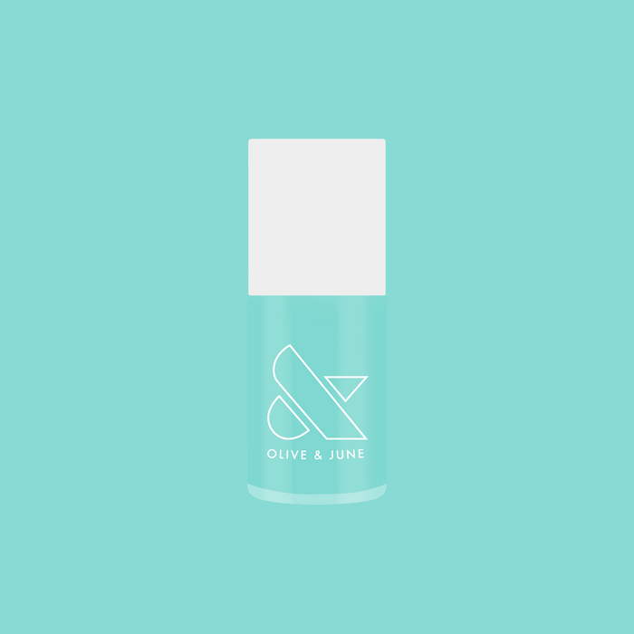 Slam Dunk nail polish bottle in true turquoise shade by Olive and June for vibrant at-home manicure.
