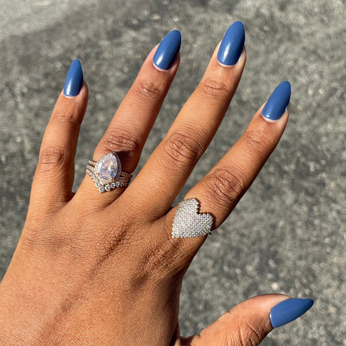 Social Studies - Press-On | Medium | Almond deep sun-bleached navy medium almond press-on nails on hand with rings