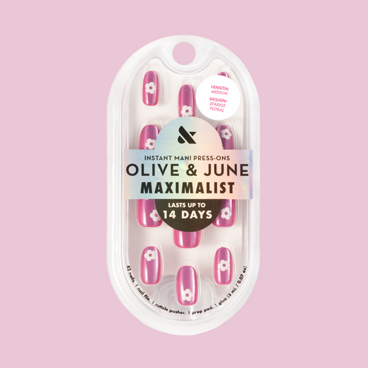 Sparkle Floral - Press-On | Medium | Oval nails with glittery pink base and white floral accents for a stylish mani look