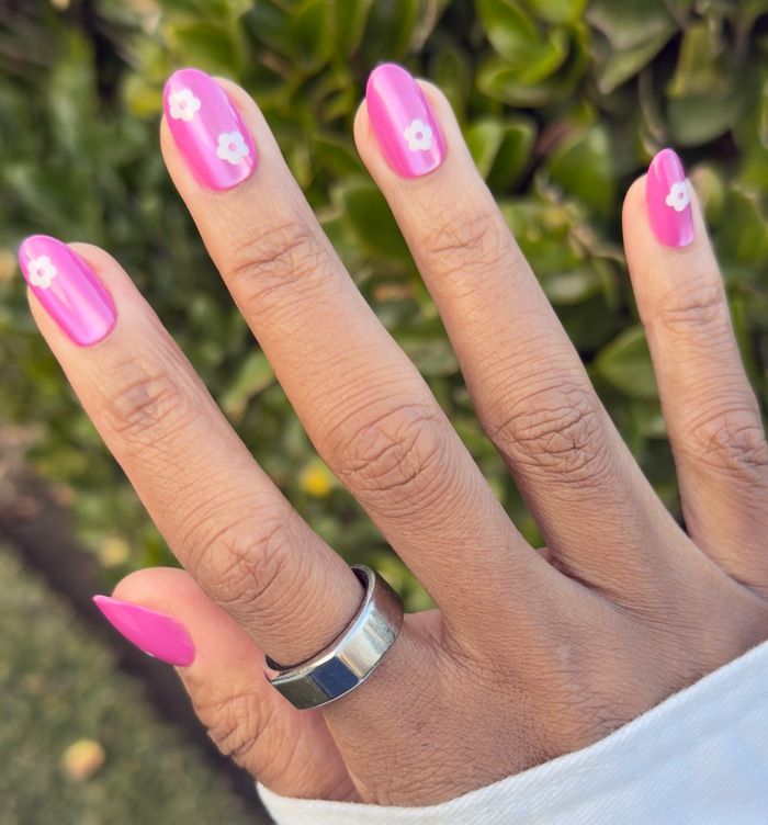 Sparkle Floral - Press-On | Medium | Oval nails with bright pink polish and white flower accents for a fresh mani look