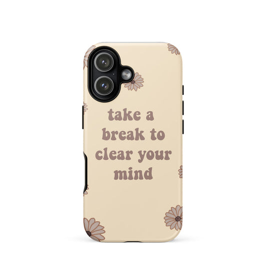 Phone case with floral design and motivational text on a beige background