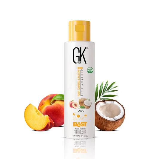 GK Hair's The Best Coco 100ml in-between a broken coconut and a whole apple alongside a sliced apple