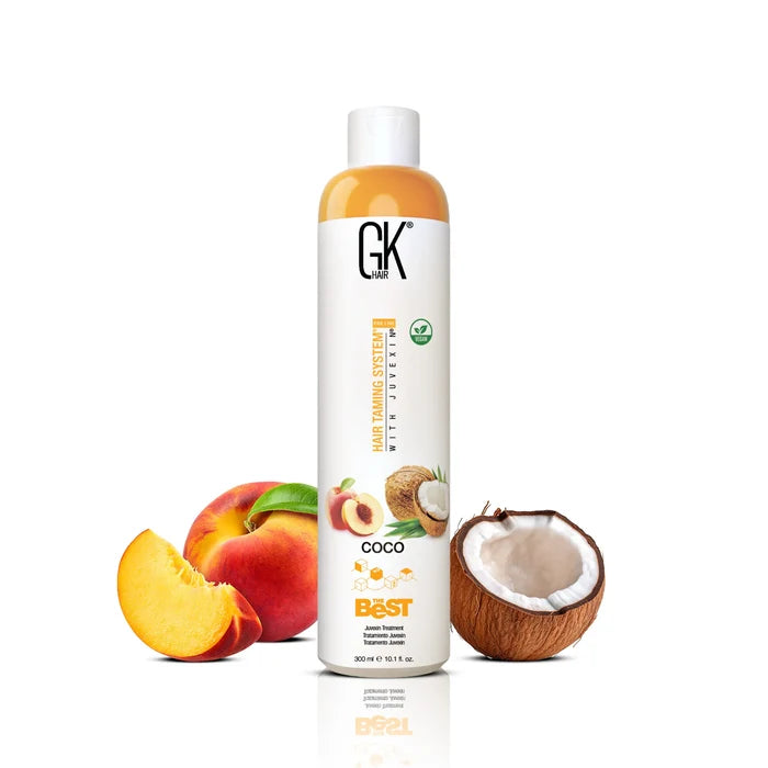GK Hair's The Best Coco 300ml in-between a broken coconut and a whole apple alongside a sliced apple