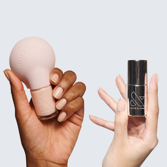 Two hands holding nail polish bottles from THE STARTER SET with natural nails for an easy manicure