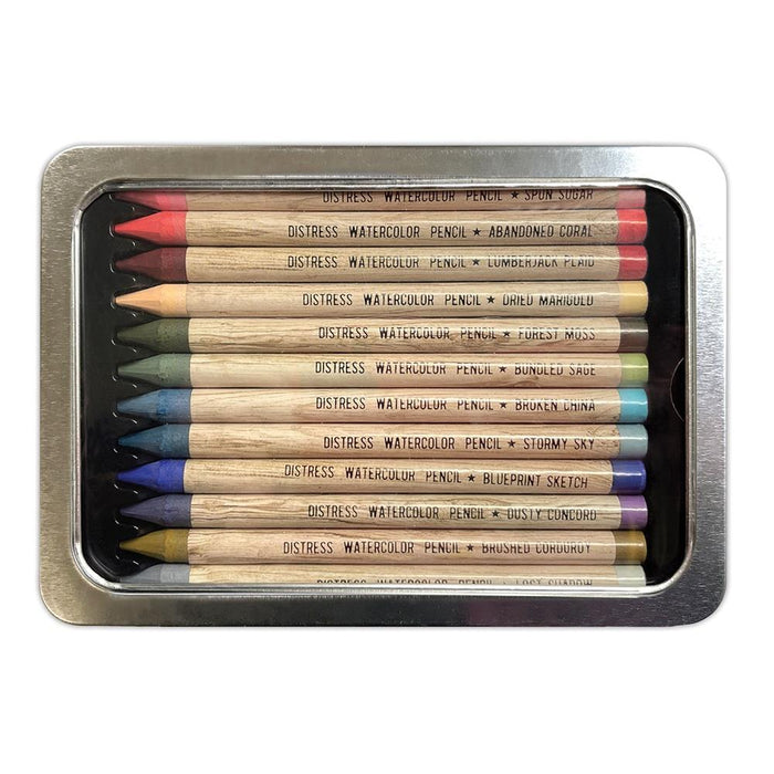 Tim Holtz - Distress Watercolor Pencils 12/Pkg Set 6. These are woodless watercolor pencils formulated to achieve vibrant coloring effects on porous surfaces. Water-reactive pigments are ideal for water coloring, shading, sketching, etc. Available at Embellish Away located in Bowmanville Ontario Canada.