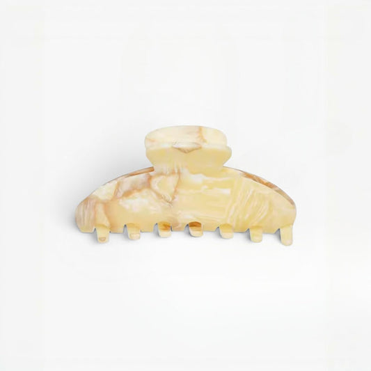 Beige hair clip on a white background