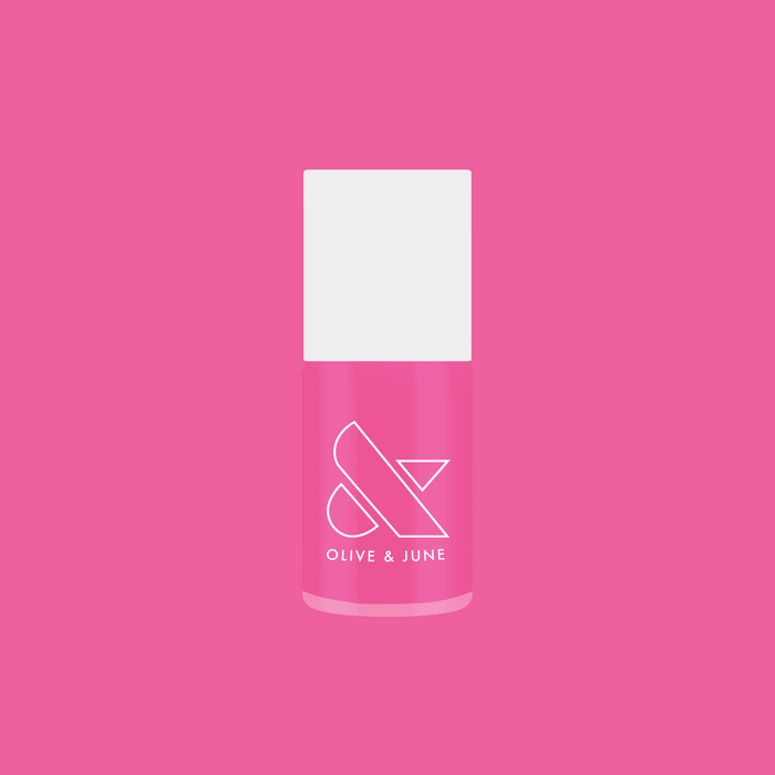 Your Favorite Suit bright peony pink gel polish bottle on vibrant pink background for mani and at home pedis